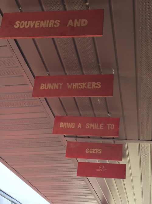 A Burma Shave-style sign hangs from the roof of Henry's Rabbit Ranch.